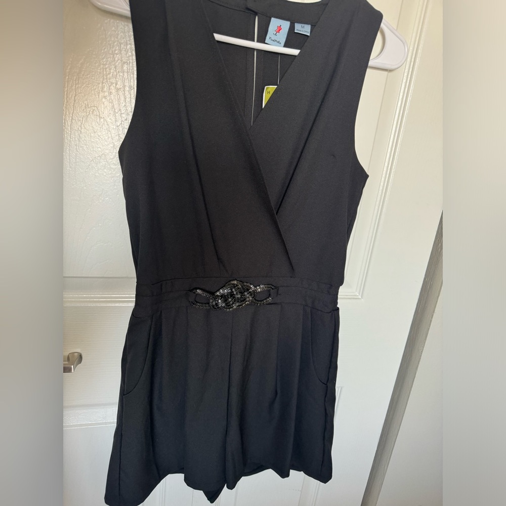 Size medium black blouse romper with metal detail